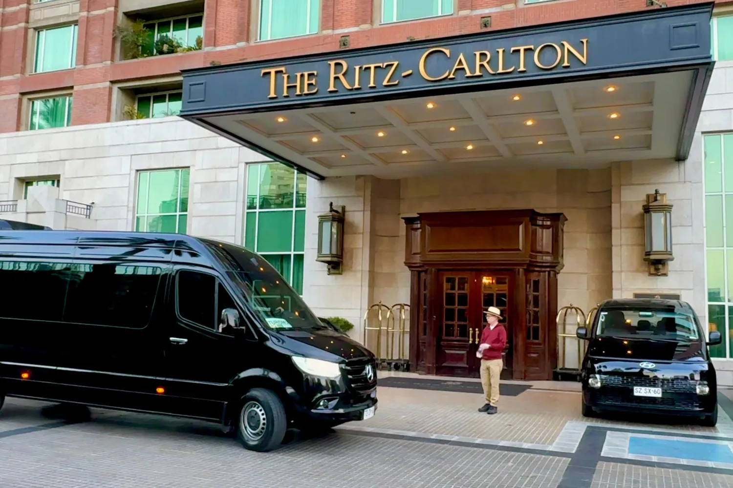 A tour vehicle at a Santiago hotel for morning pickup